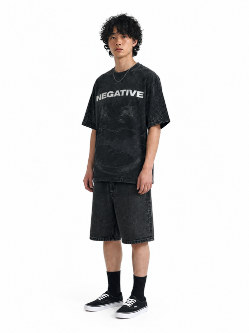 Be Negative tee black acid wash, three-quarter view, on model