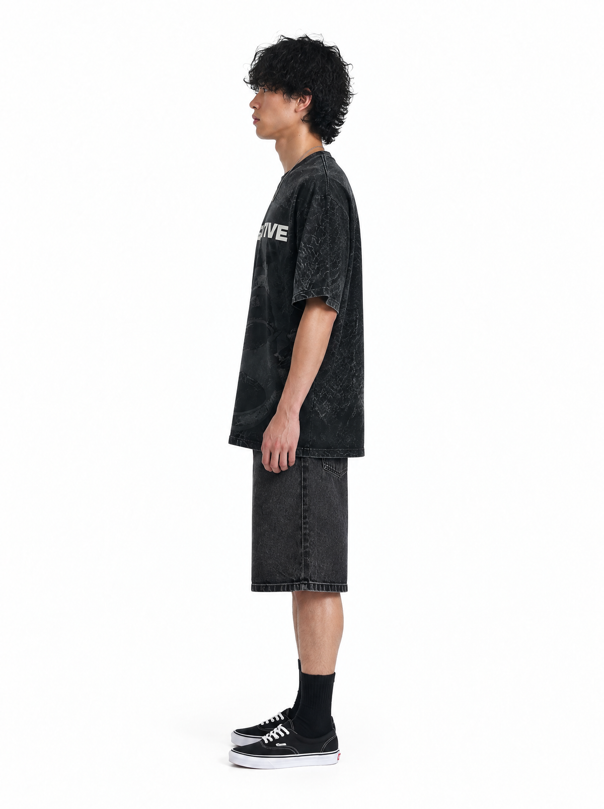 Be Negative tee black acid wash, side view, on model